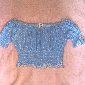 This is a extra small, light blue, off the shoulder crop top!